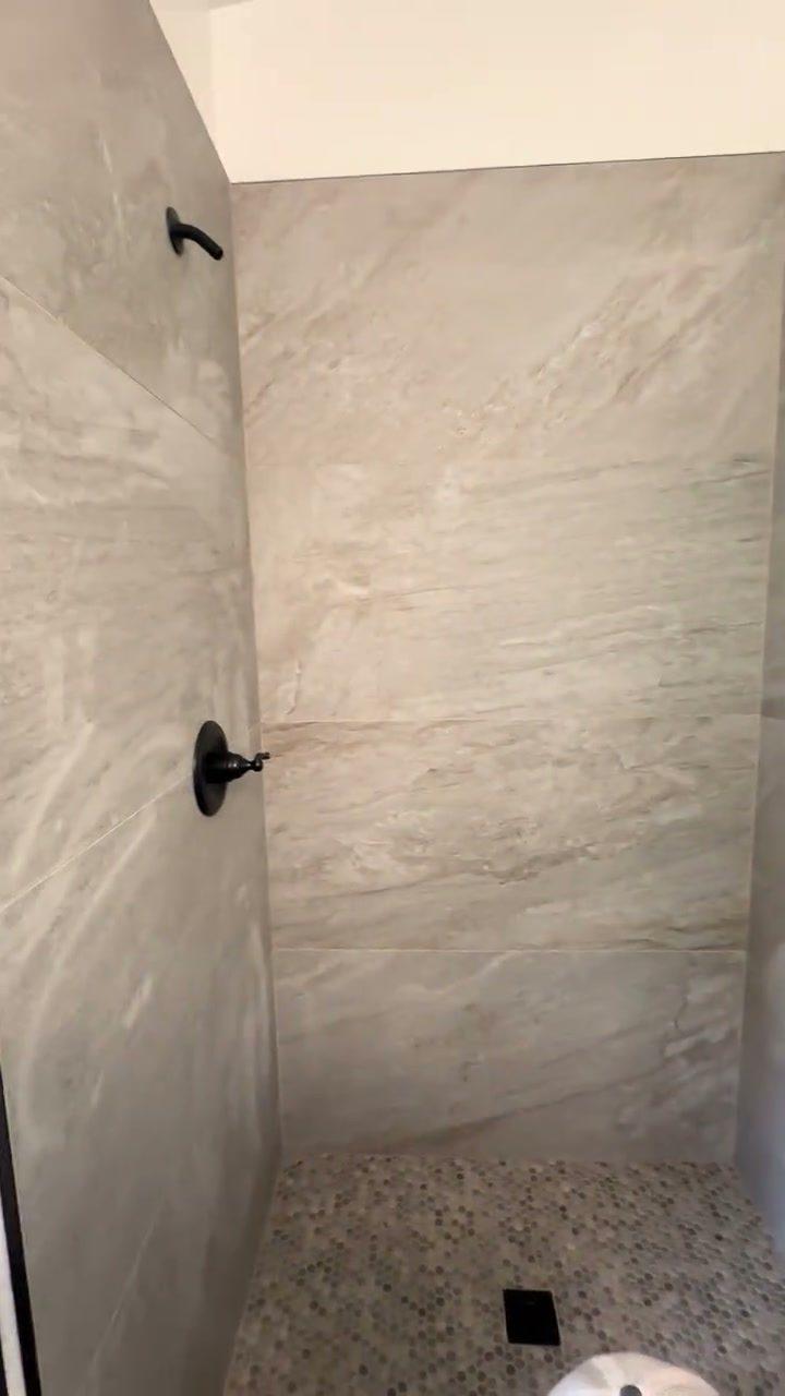 Walk-in shower with large-format tile and pebble floor, Flagstaff, AZ