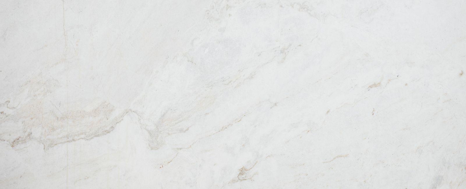 Calacatta Umber Honed — available at X Cabinet & Stone Flagstaff